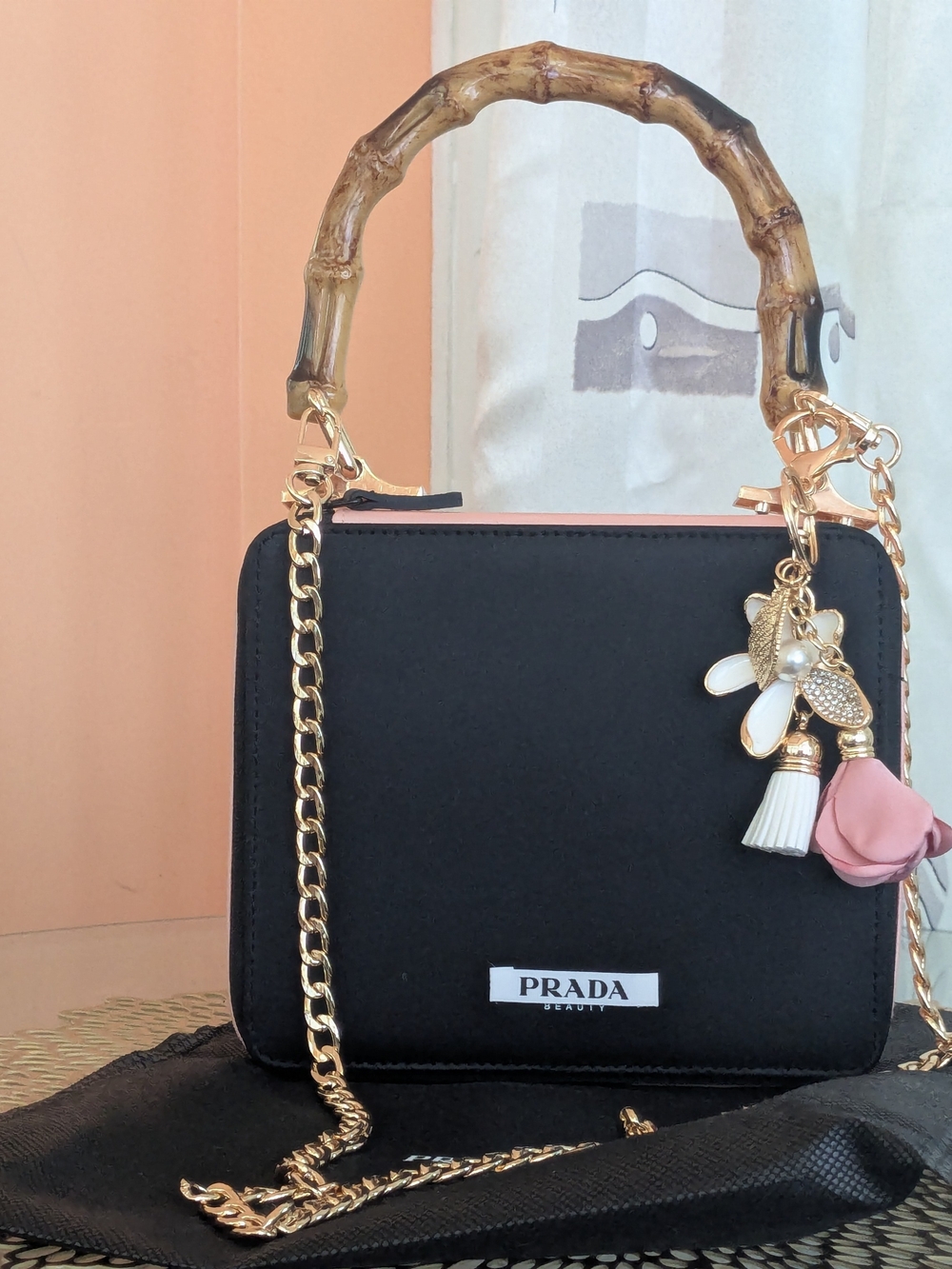 Prada Black Crossbody Bag with Bamboo Handle & Pink Flower Charm - Picture 3 of 9